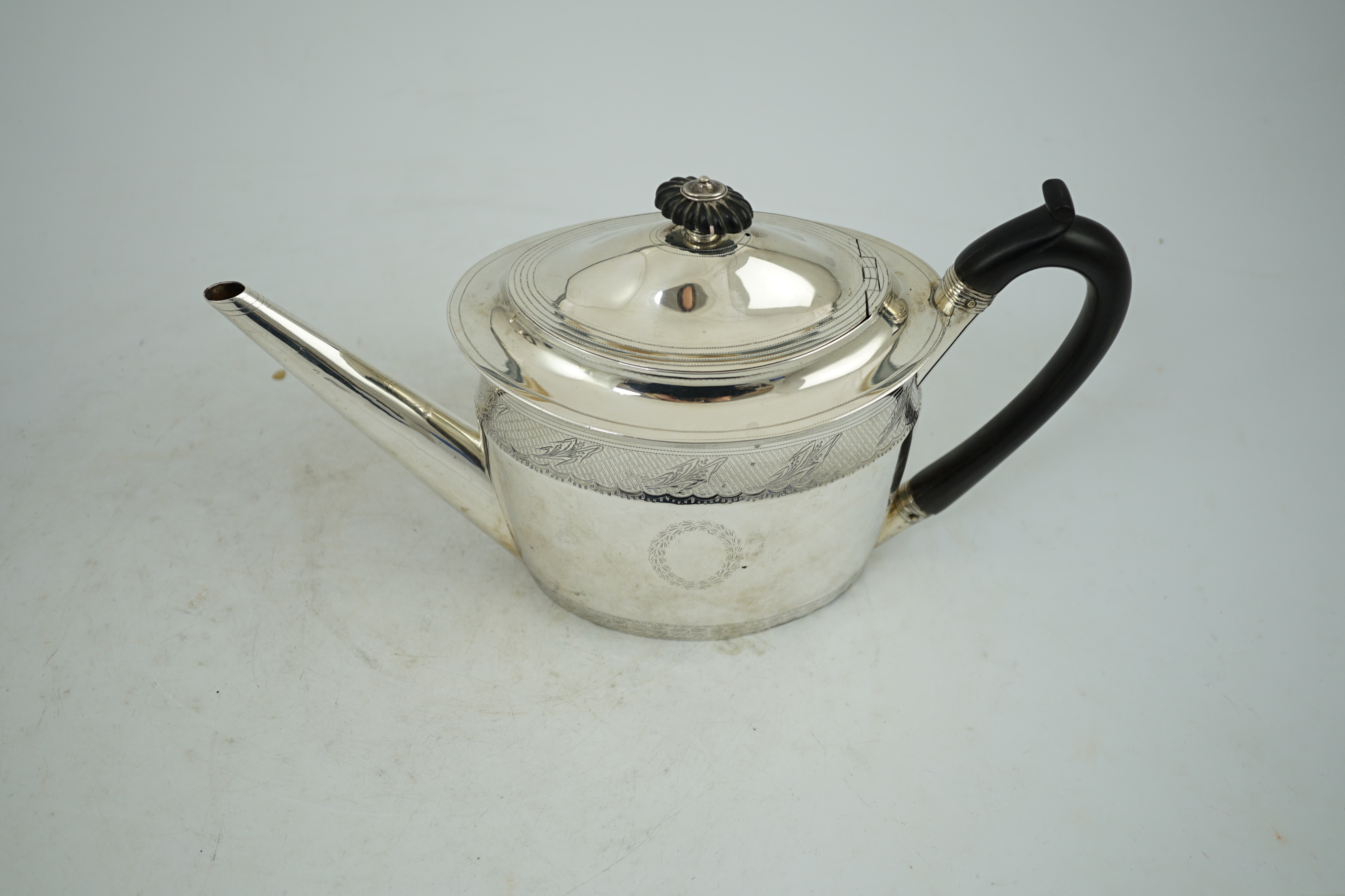 A George III engraved silver oval teapot, Chawner & Emes, London, 1797, gross weight 15.5oz.